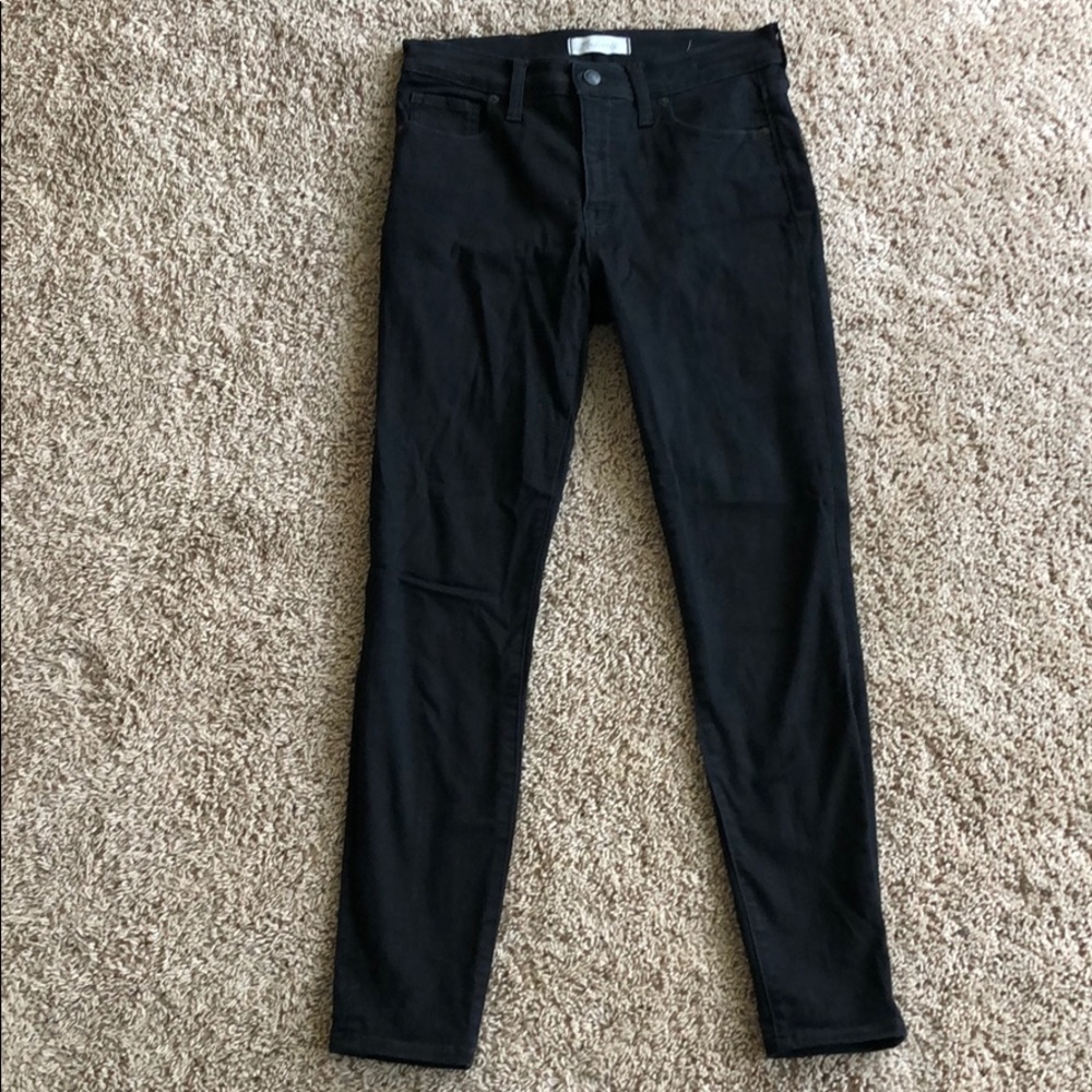 Madewell 9” high rise skinny in black.